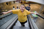 Richard Carbone riding up an escalator