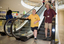 Mal Fraser and Richard Carbone leaving a descending escalator