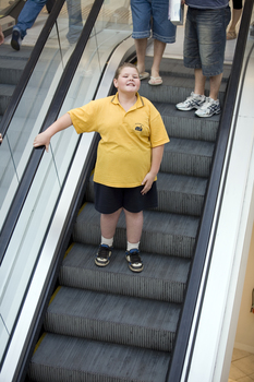 Richard Carbone on a descending escalator
