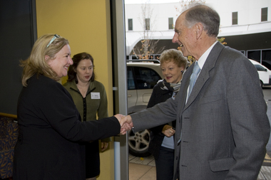 Julie Rae greets John and Nancye Cain with Debra Rosenfeldt looking on