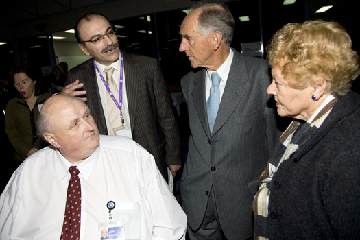 Jim Pipczak demonstrating magnifiers and screen reader to John and Nancye Cain and Tony Iezzi