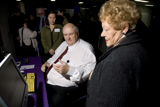 Jim Pipczak demonstrating a magnifier to Nancye Cain with Debra Rosenfeldt