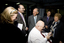 Jim Pipczak demonstrating a Nokia screen reader to John and Nancye Cain, with Julie Rae, Tony Iezzi and unknown staff member looking on
