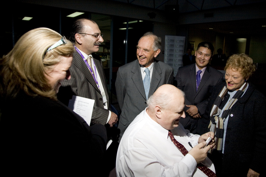 Jim Pipczak demonstrating a Nokia screen reader to John and Nancye Cain, with Julie Rae, Tony Iezzi and unknown staff member looking on