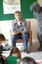 Adults, children and the Big Bad Wolf (aka Ed Gamble) listening to 'The Three Little Pigs'.