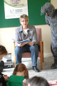 Adults, children and the Big Bad Wolf (aka Ed Gamble) listening to 'The Three Little Pigs'.