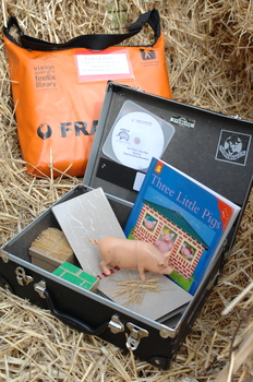 Feelix kit for 'The Three Little Pigs' with book, CD, tactile book and physical objects about the story