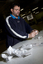 Man packaging items at a bench