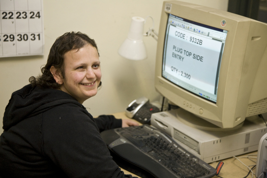 Gena Kacowicz using a computer in an office