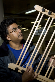 Man holding clothes drying rack
