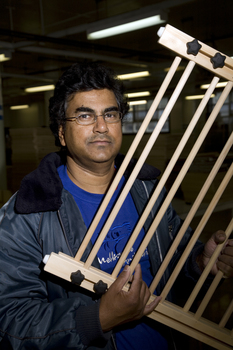 Man holding clothes drying rack