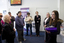 White cane users listen to directions in the Travellers Aid office