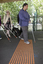 White cane users walking along the train platform