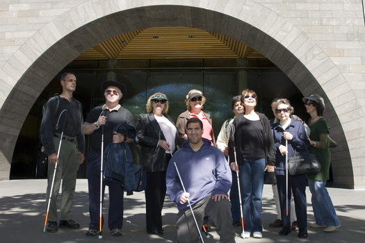 Group of people with their canes outside the Art Gallery