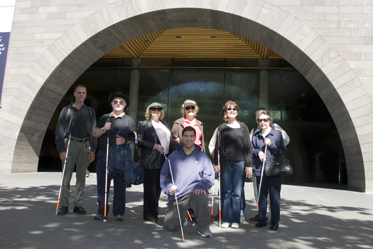 Group of people with their canes outside the Art Gallery