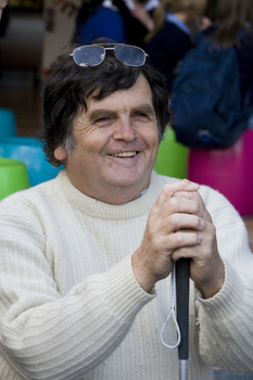 White cane user at Southbank shopping precinct on a sunny day