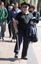 White cane users walking along the St Kilda Road footpath on a sunny day