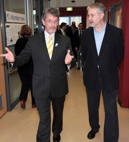 Tim Evans leads Gavin Jennings into the presentation in the Day Centre