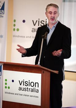 Gavin Jennings speaking from the podium