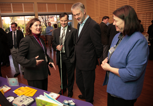 Deborah Mould showing Feelix kits to Gavin Jennings with Christine Harding and Chris Edwards