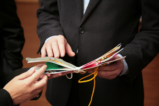 Gavin Jennings touching the pages of a tactile book in the Feelix kit
