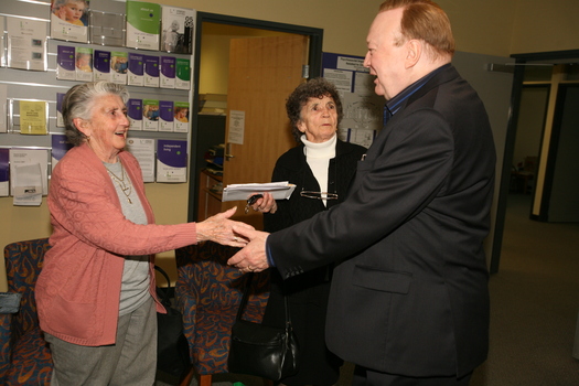 Bert Newton meets two admirers in the waiting area