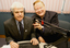 Bert Newton holds microphone towards Stephen Jolley in the studio