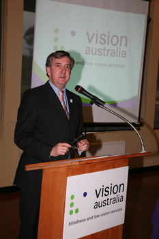 Gerard Menses speaking at the podium