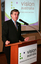 Gerard Menses speaking at the podium