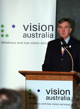 Gerard Menses speaking at the podium