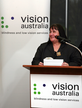 Maryanne Diamond speaking at the podium
