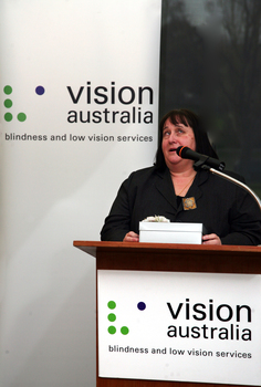 Maryanne Diamond speaking at the podium