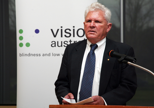 David Blyth speaking at the podium