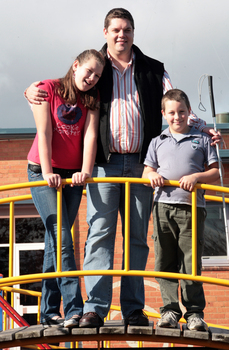 Tony Clarke with his son and daughter in a playground