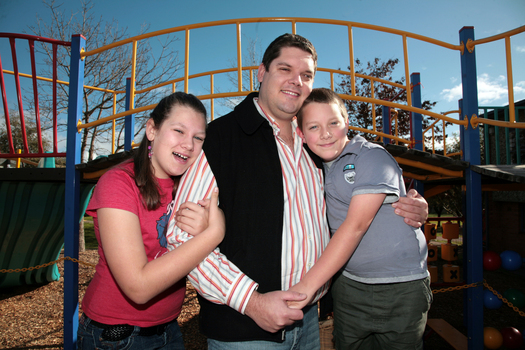 Tony Clarke with his son and daughter in a playground