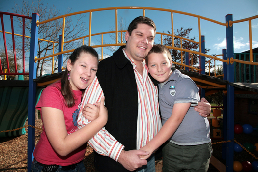 Tony Clarke with his son and daughter in a playground