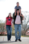 Tony Clarke with his son and daughter walking in a schoolyard