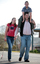 Tony Clarke with his son and daughter walking in a schoolyard