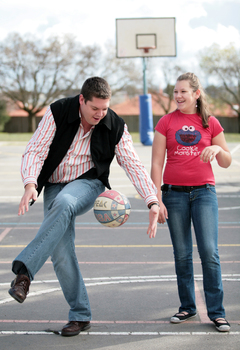 Tony Clarke looking to do a trick bounce whilst his daughter looks on at his showing off