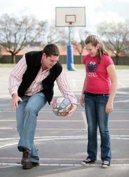 Tony Clarke looking to do a trick bounce whilst his daughter looks on at his showing off