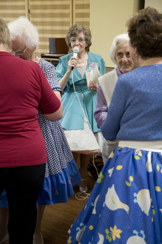 Margaret Fox encourages the crowd to join a dance