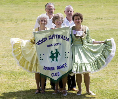 Virgil Snyder, Margaret Fox, Wanda Egerton and VA Square Dance club members with their banner