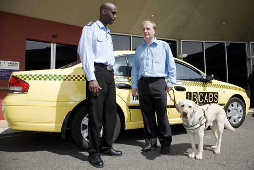 Taxi driver with Jamie Kelly and guide dog
