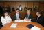Nadia Mattiazzo, Dr Kevin Murfitt, BCA person and Gerard Menses signing the memorandum