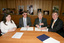 Nadia Mattiazzo, Dr Kevin Murfitt, BCA person and Gerard Menses signing the memorandum
