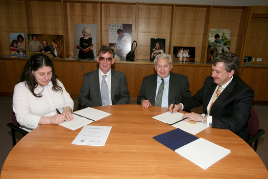 Nadia Mattiazzo, Dr Kevin Murfitt, BCA person and Gerard Menses signing the memorandum