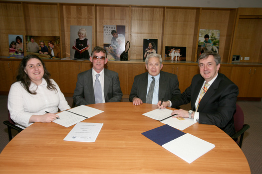 Nadia Mattiazzo, Dr Kevin Murfitt, BCA person and Gerard Menses signing the memorandum