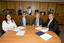 Nadia Mattiazzo, Dr Kevin Murfitt, BCA person and Gerard Menses signing the memorandum