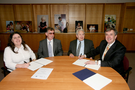 Nadia Mattiazzo, Dr Kevin Murfitt, BCA person and Gerard Menses signing the memorandum