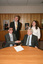 Dr Kevin Murfitt shaking hands with BCA person whilst Gerard Menses and Nadia Mattiazzo look on